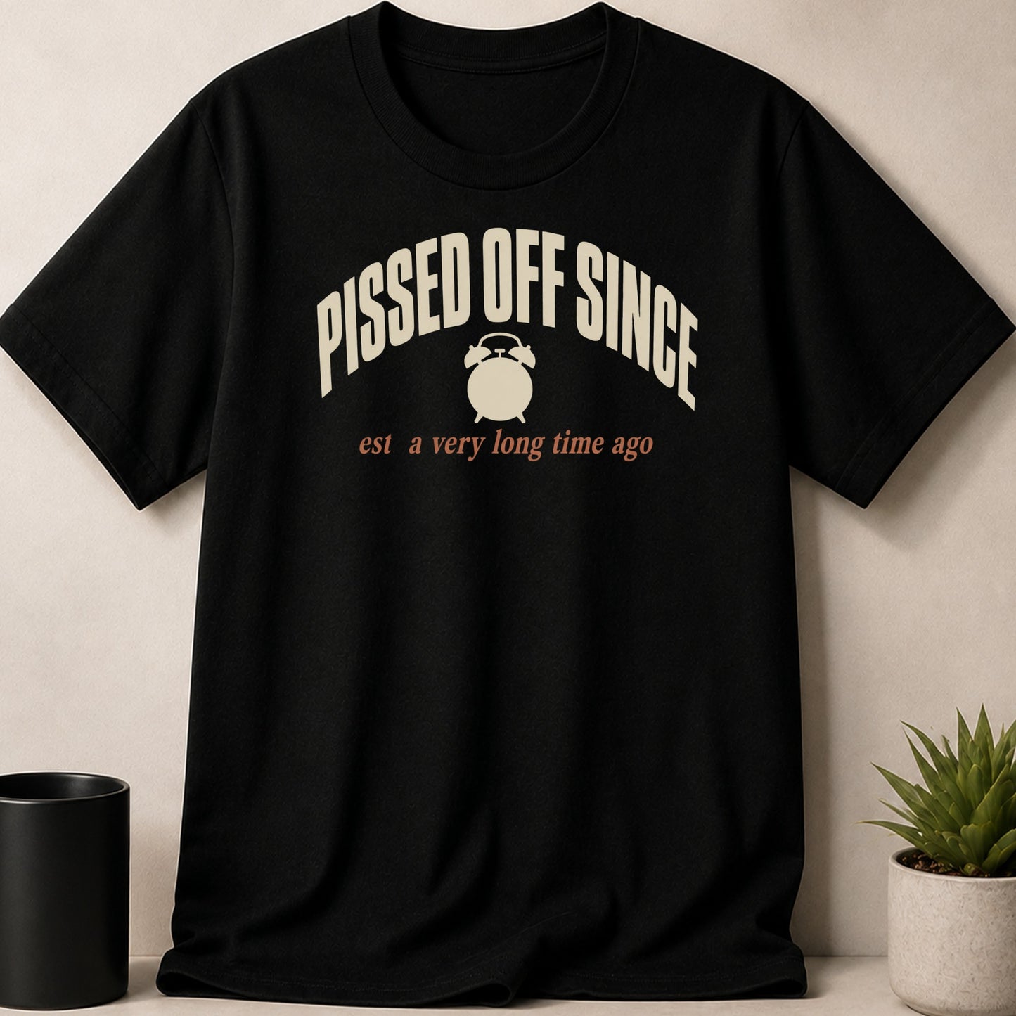 Black t-shirt with "Pissed Off Since est a very long time ago" and alarm clock graphic.