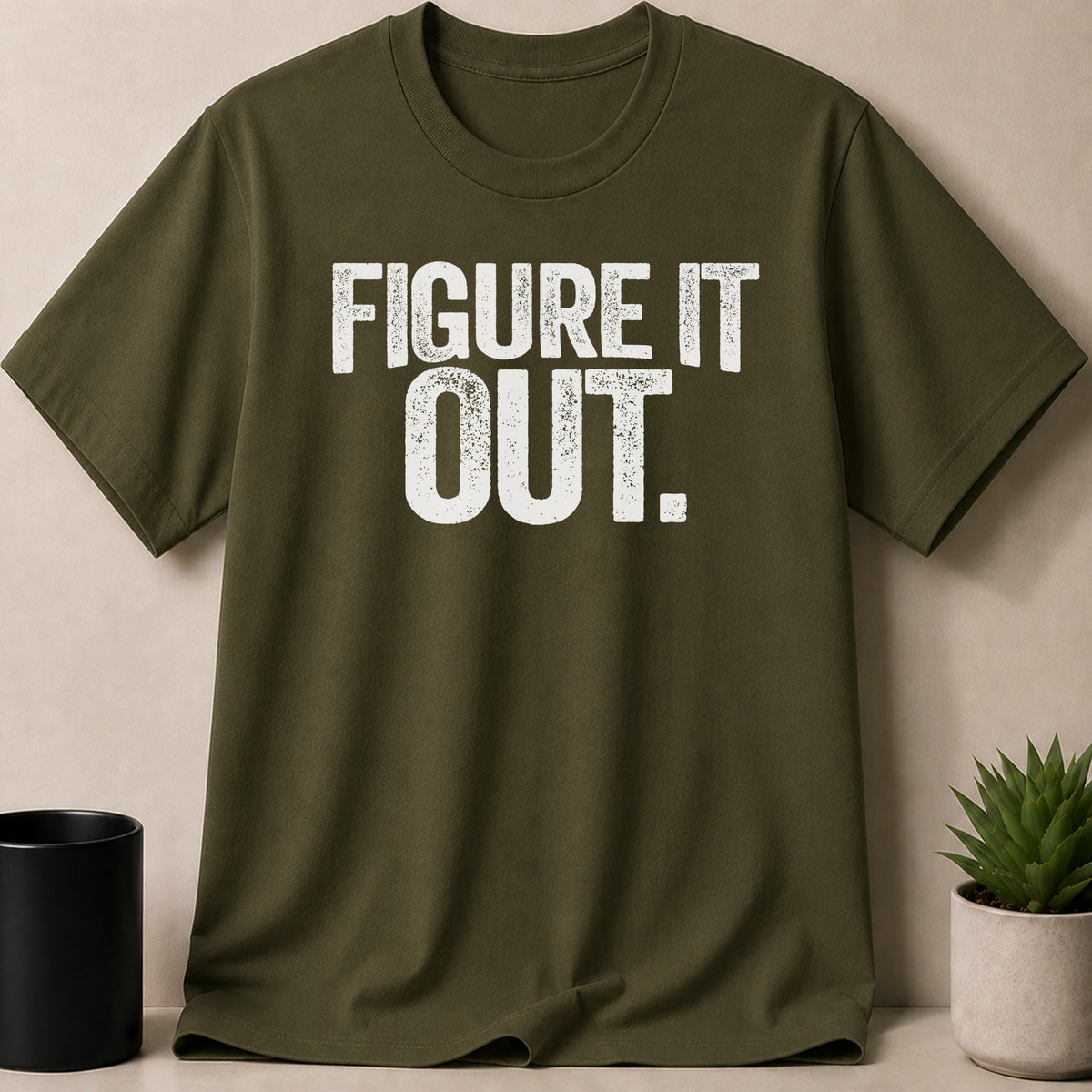 Green t-shirt with white text that reads "FIGURE IT OUT."