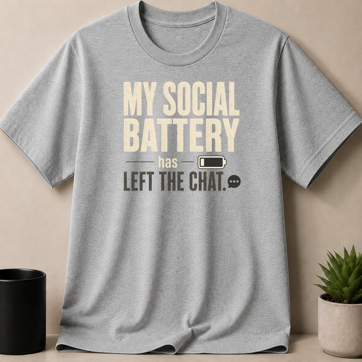 Grey t-shirt with "MY SOCIAL BATTERY has LEFT THE CHAT." text and icons.