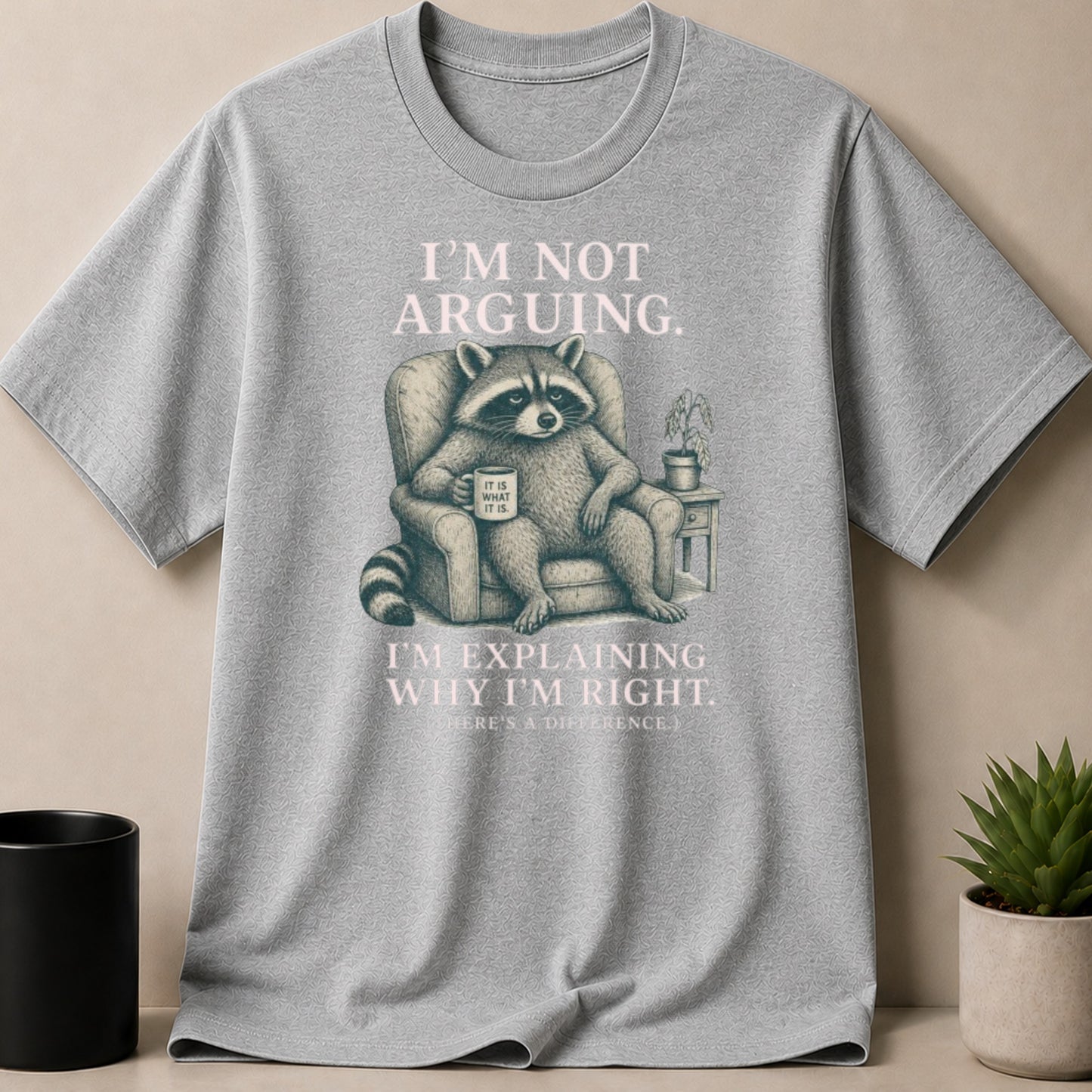 T-shirt with raccoon on armchair stating "I'm not arguing. I'm explaining why I'm right."