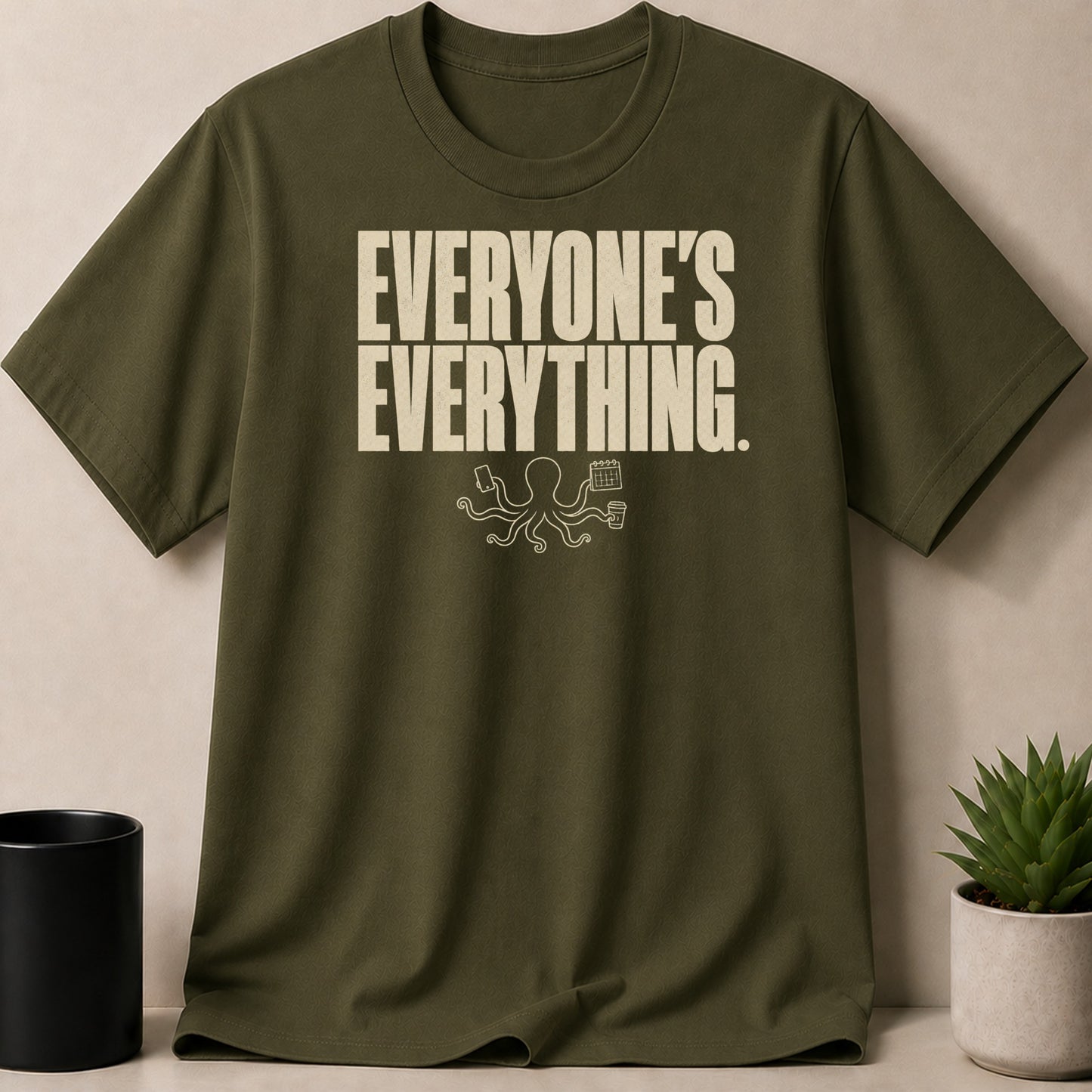 Green t-shirt with "Everyone's Everything" text and an octopus graphic.