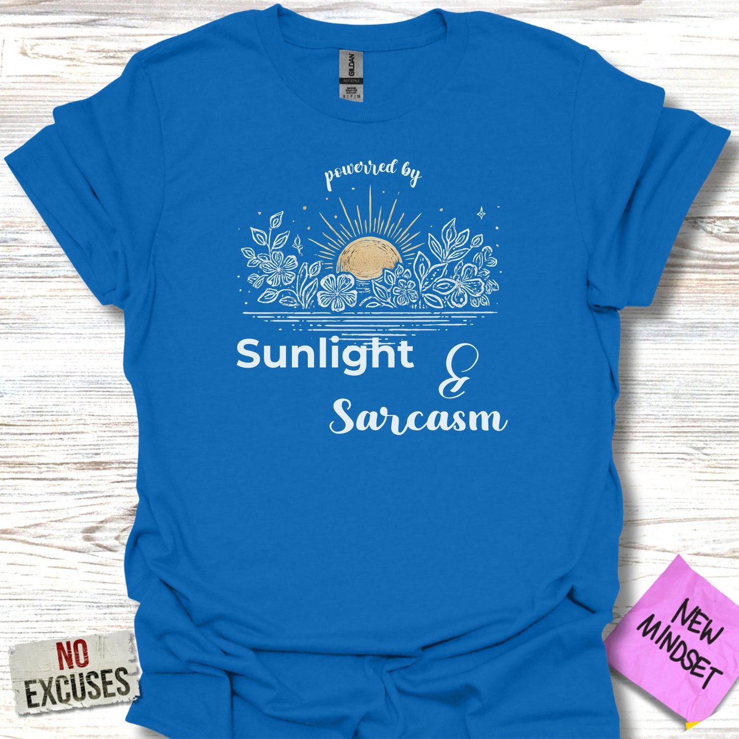 Powered by Sunlight and Sarcasm graphic tee product