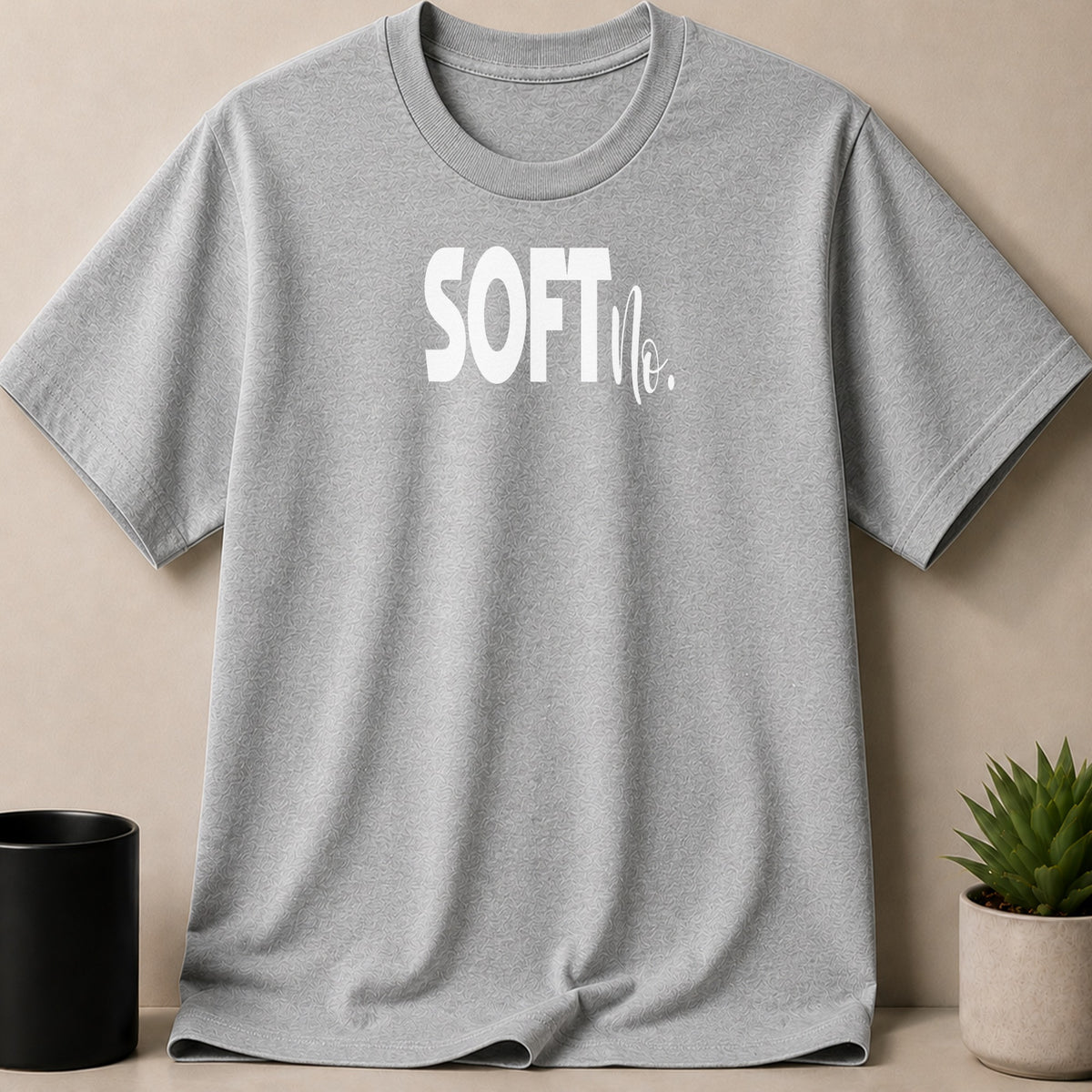 Grey t-shirt with white "SOFT No." text and subtle textured pattern.