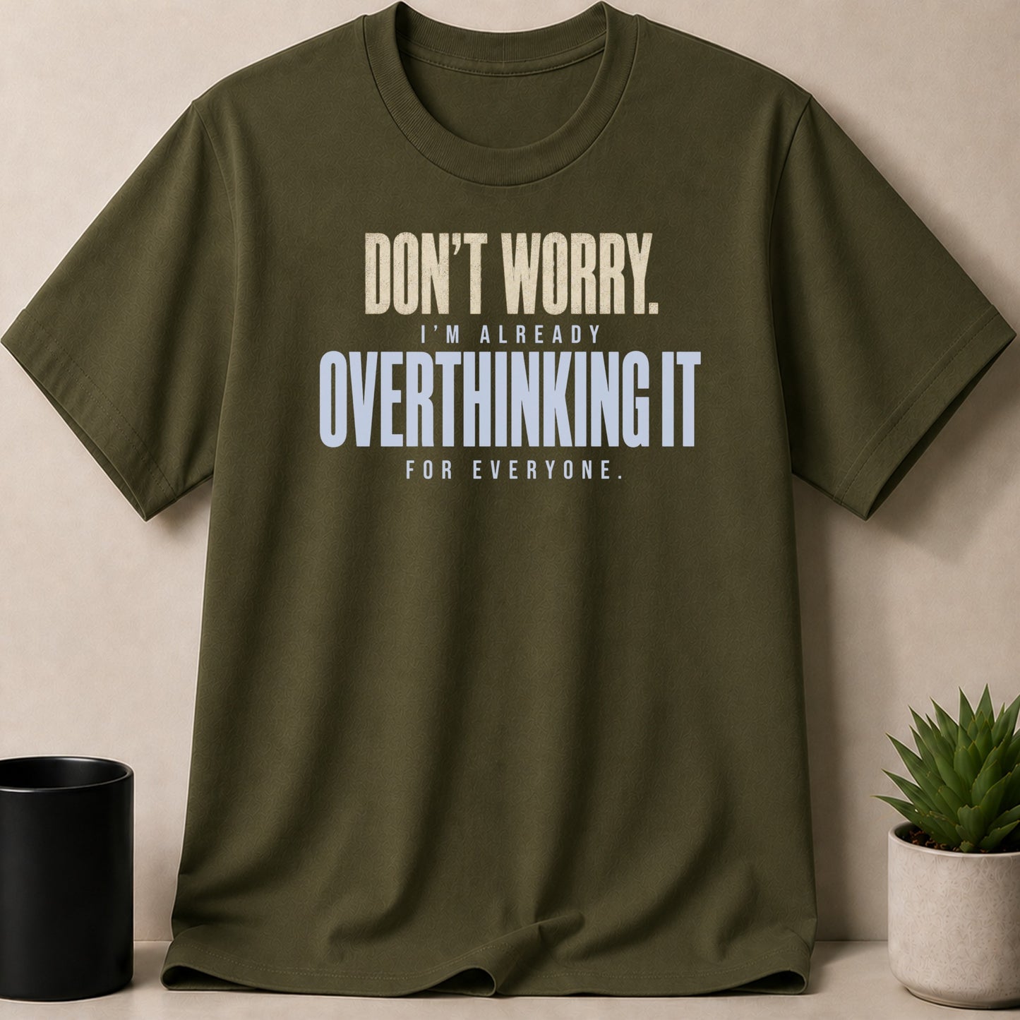 Olive green t-shirt with text "DON'T WORRY. I'M ALREADY OVERTHINKING IT FOR EVERYONE."