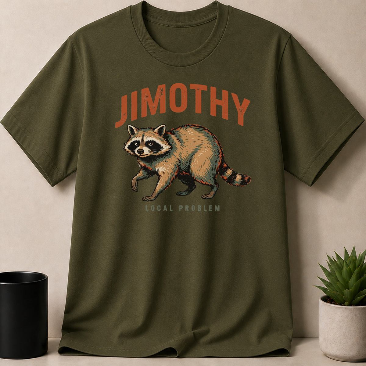 Green t-shirt with raccoon graphic and text "JIMOTHY LOCAL PROBLEM".
