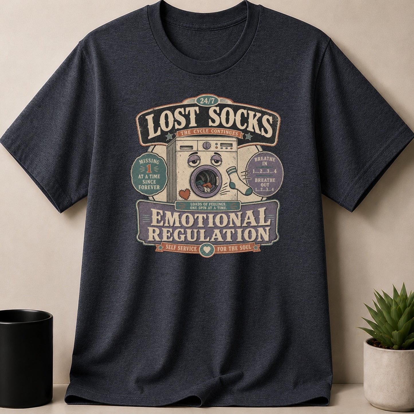 T-shirt graphic with "Lost Socks" and "Emotional Regulation" text around a washing machine.