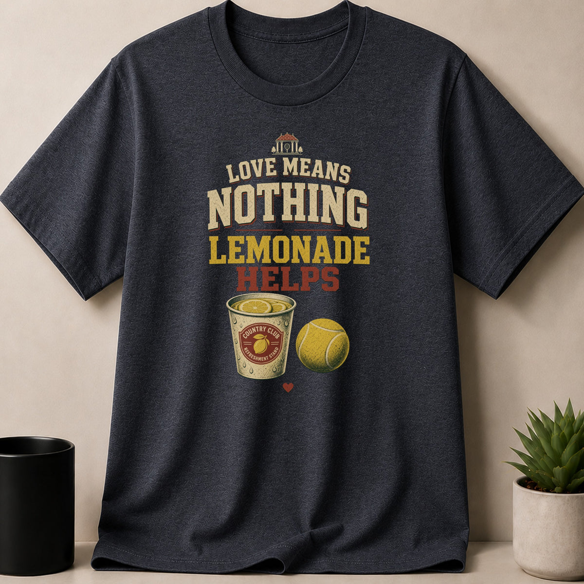 Dark grey t-shirt graphic with "Love Means Nothing Lemonade Helps" and country club lemonade.