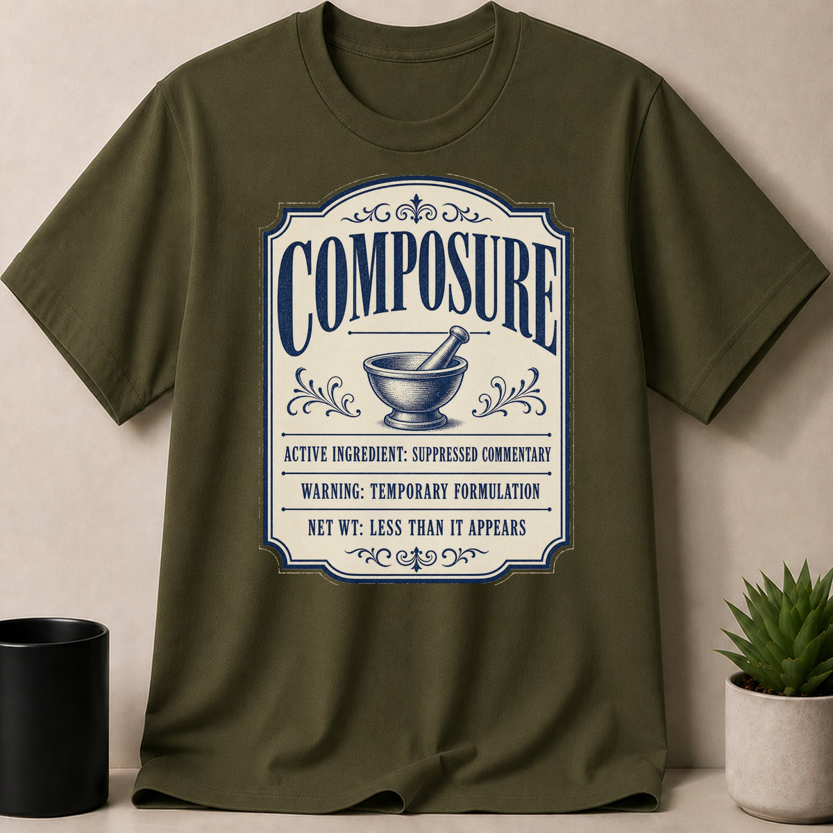 Olive green t-shirt with "COMPOSURE" label and mortar and pestle.