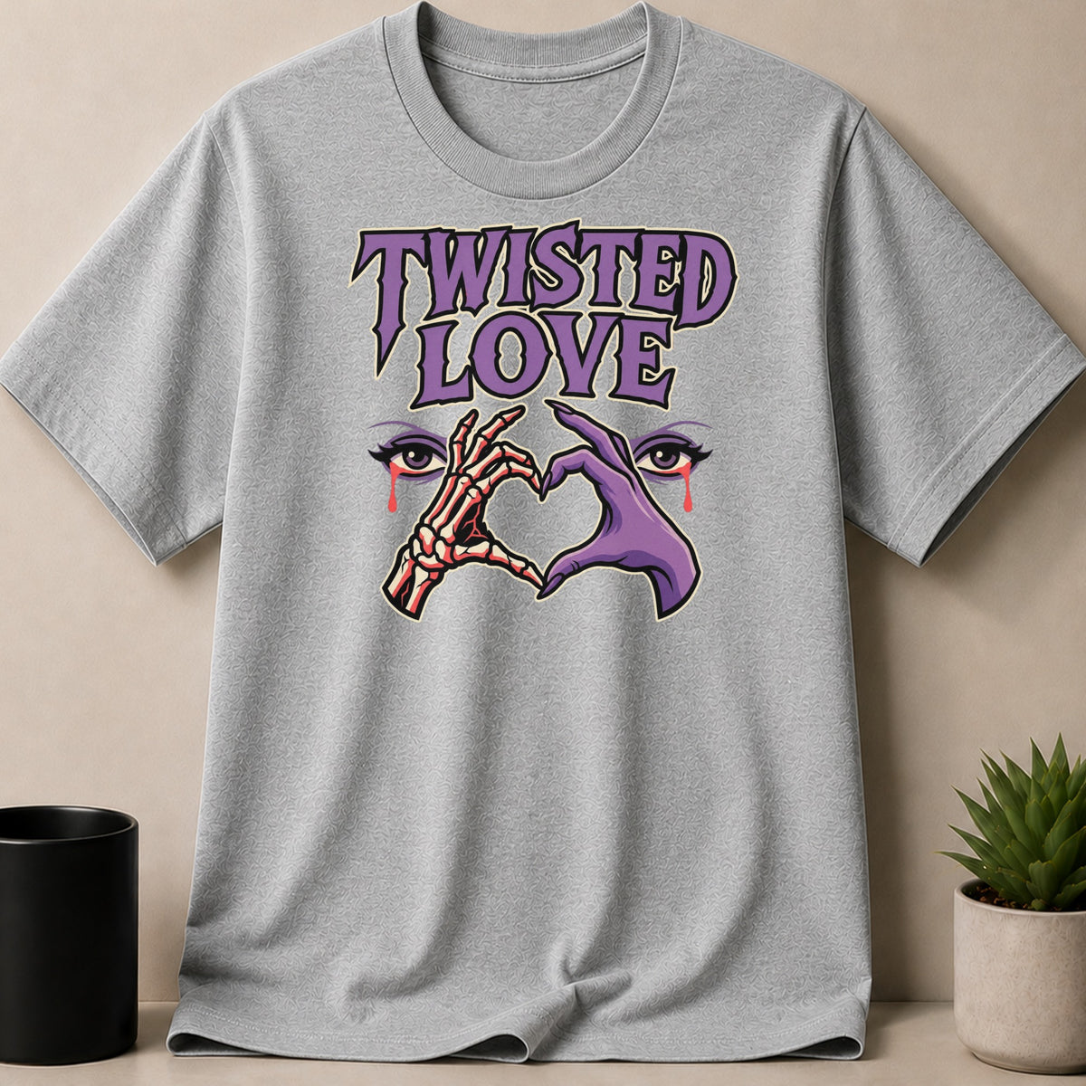 Grey t-shirt with "TWISTED LOVE" text, skeleton and purple hands forming a heart over eyes.
