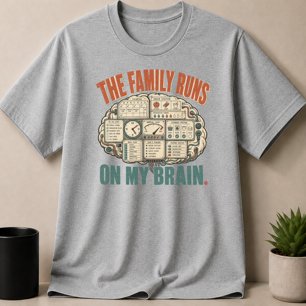 Gray t-shirt with "The Family Runs On My Brain" text and brain-themed graphics.