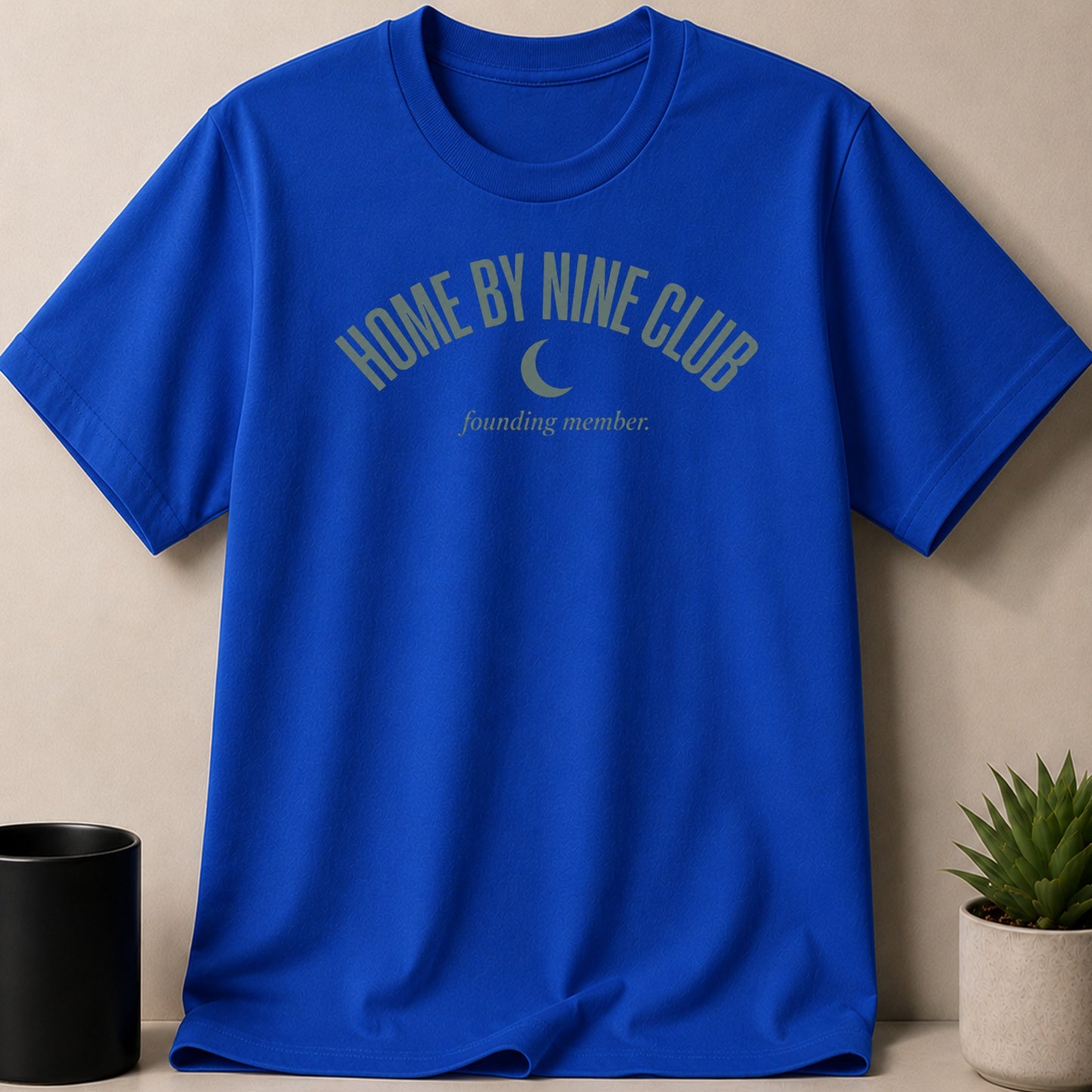 Blue t-shirt with "HOME BY NINE CLUB" and a crescent moon graphic.