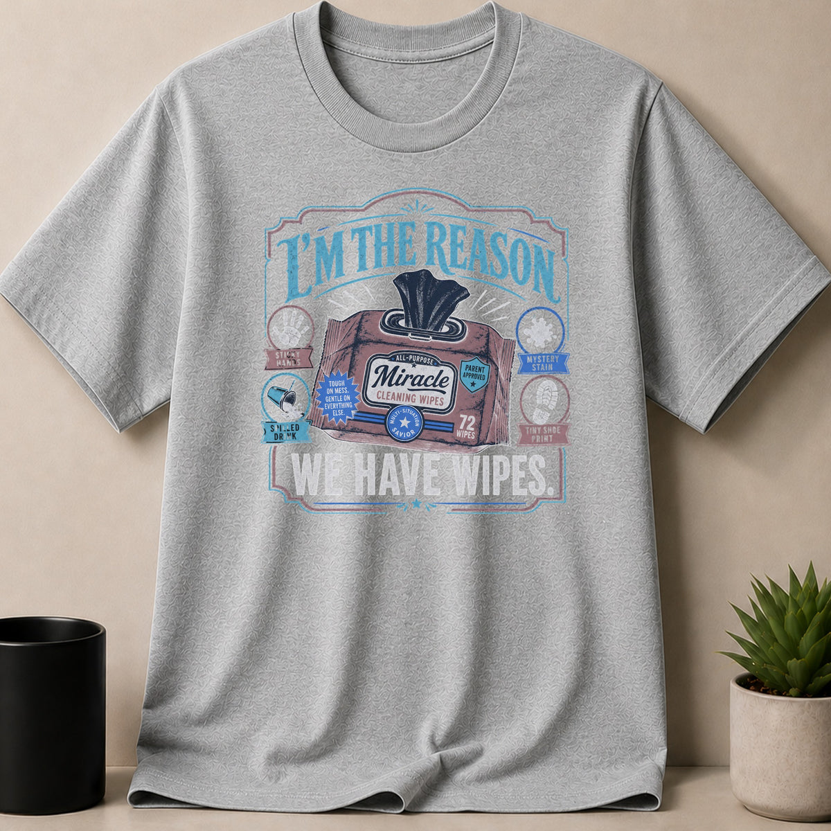 Grey t-shirt with "I'm the reason we have wipes" and a wipe icon.