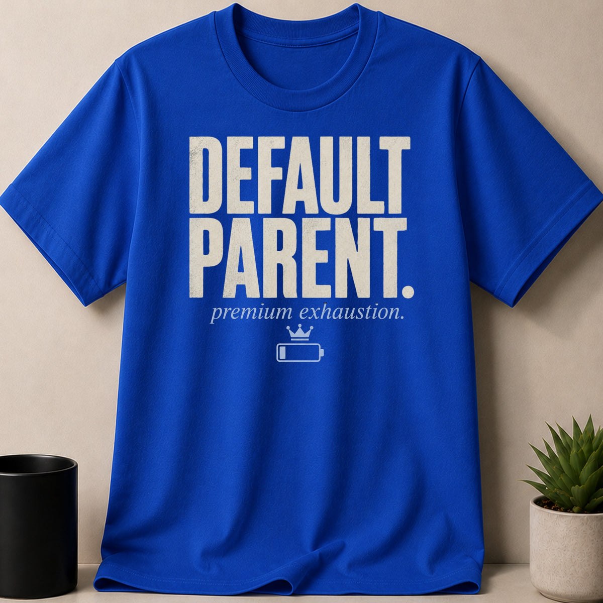 Blue t-shirt with "DEFAULT PARENT." and "premium exhaustion." text.