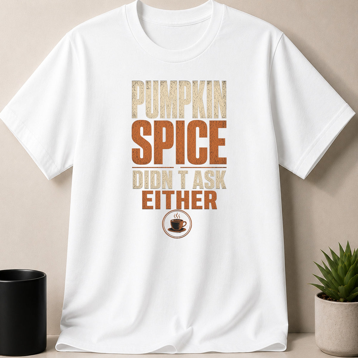 White t-shirt with "Pumpkin Spice Didn't Ask Either" text and coffee cup graphic.