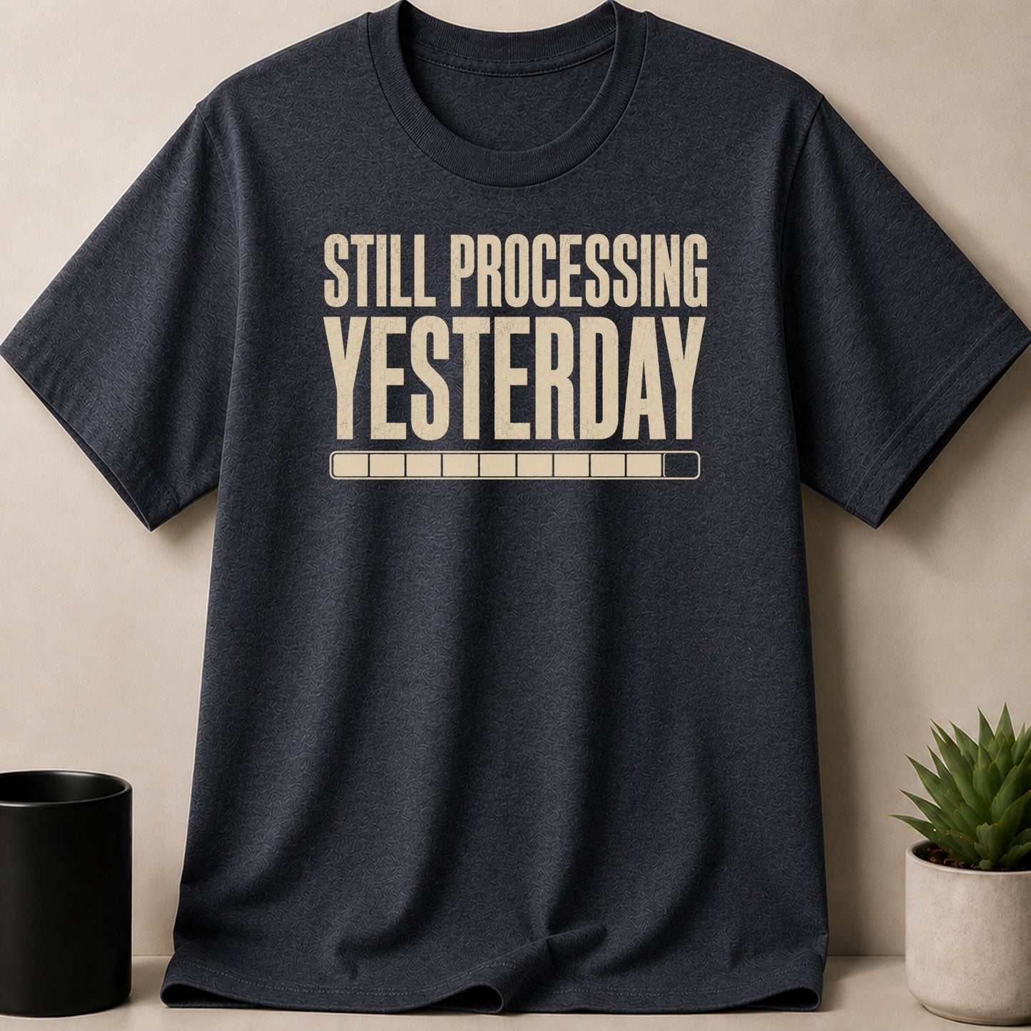 Dark gray t-shirt with "STILL PROCESSING YESTERDAY" and a loading bar.