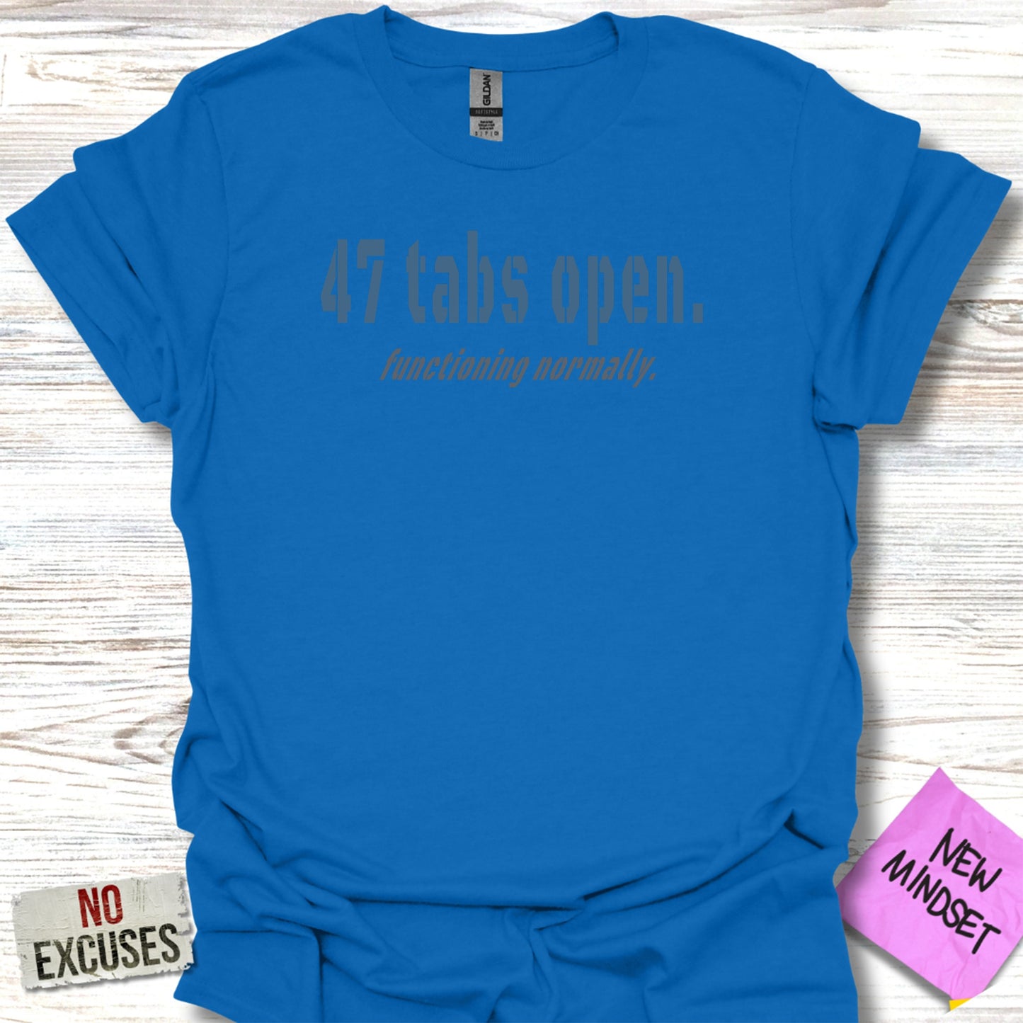 Blue t-shirt with "47 tabs open. functioning normally." text.