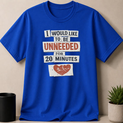 Blue t-shirt with text "I would like to be unneeded for 20 minutes" and a broken heart graphic.