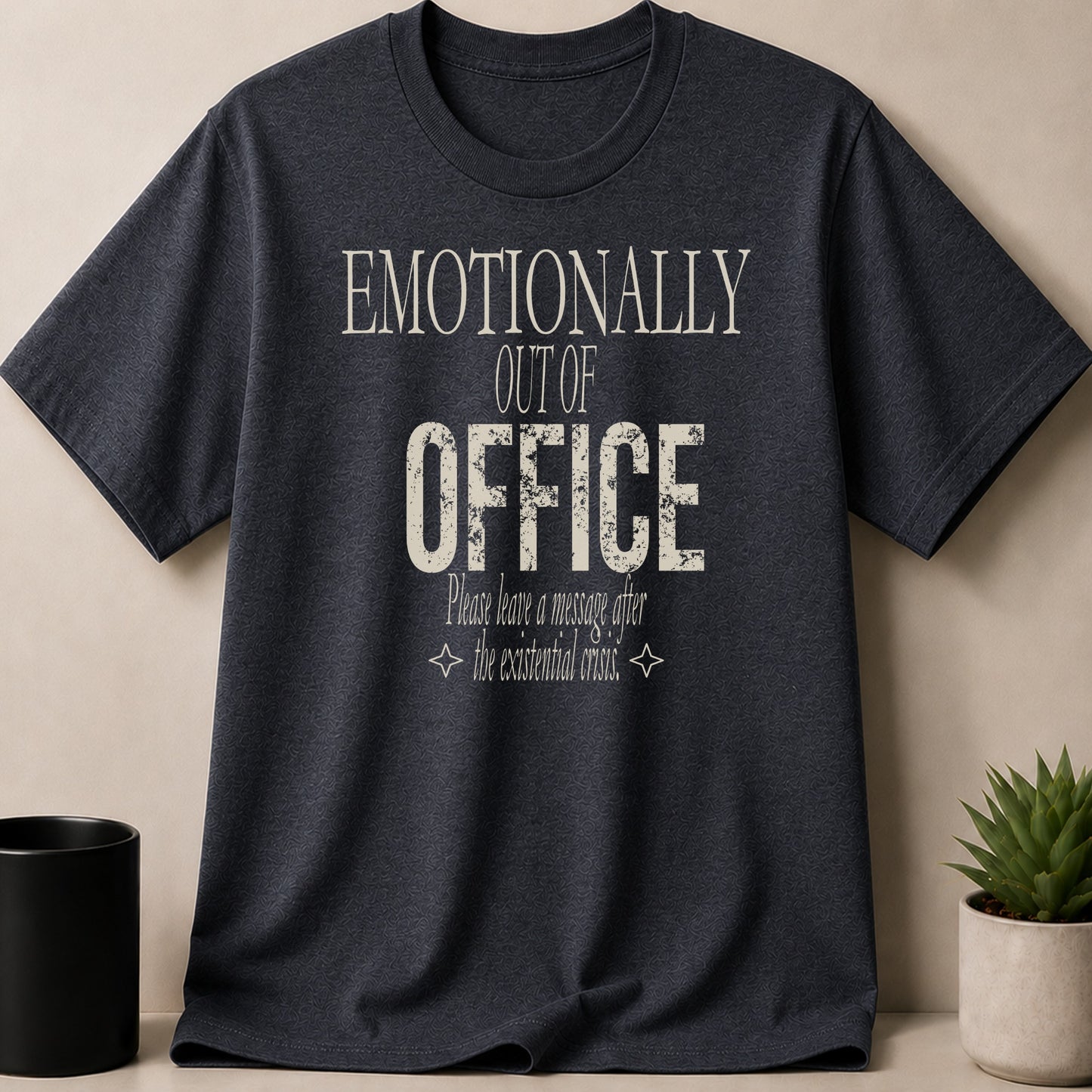 Dark t-shirt with "Emotionally Out of Office: Please leave a message after the existential crisis."