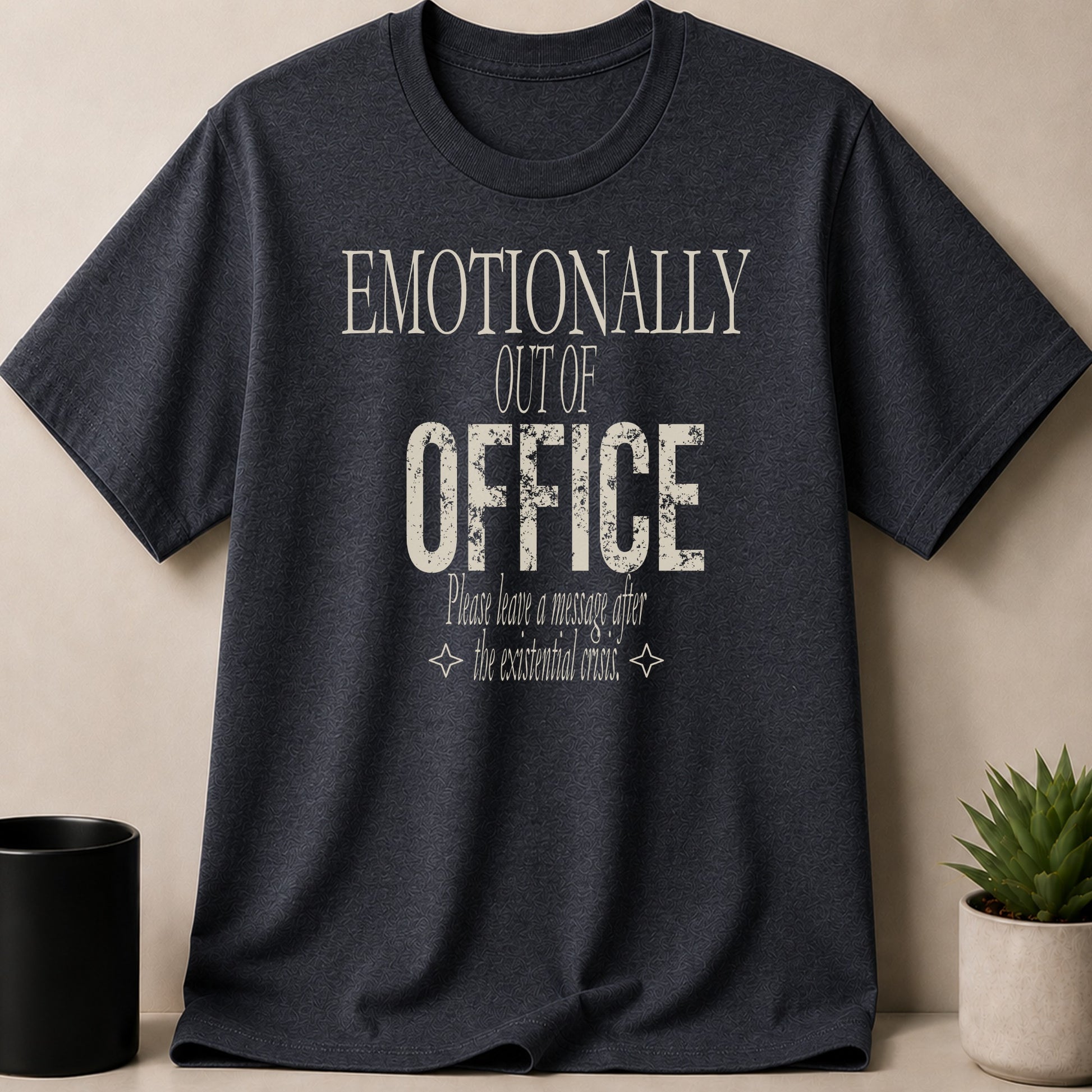Dark t-shirt with "Emotionally Out of Office: Please leave a message after the existential crisis."