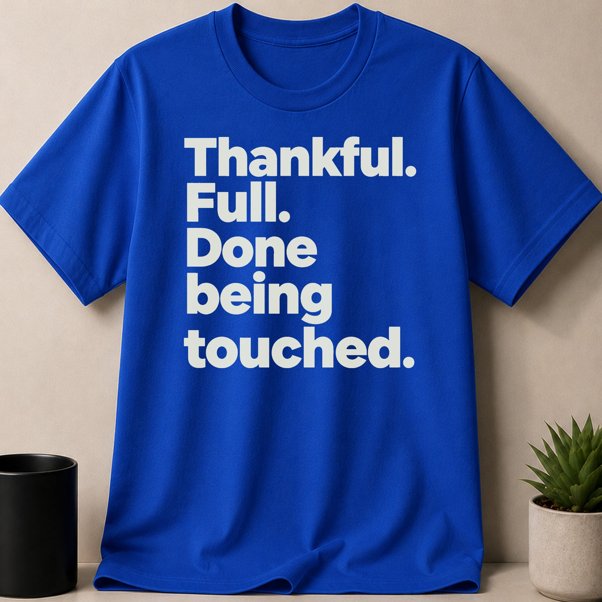 Royal blue t-shirt with white text: "Thankful. Full. Done being touched."