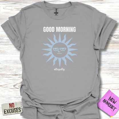 Grey t-shirt with a sun graphic and "GOOD MORNING allegedly" text.