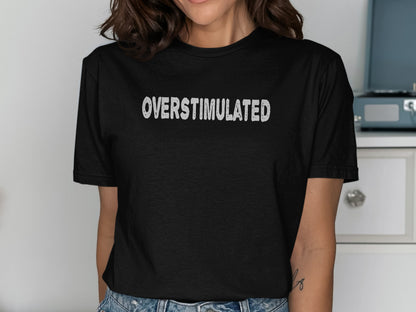 Black t-shirt with white text that reads "OVERSTIMULATED".