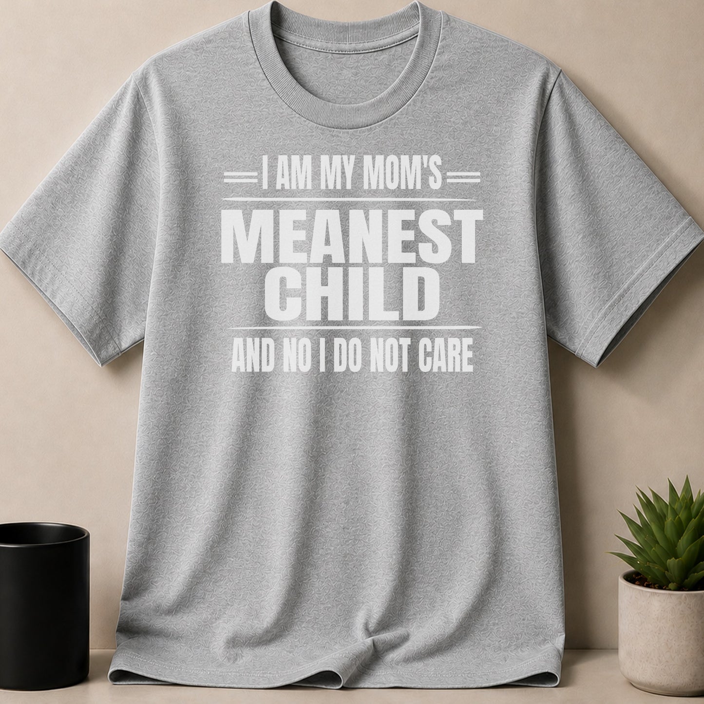 Grey t-shirt with white text "I AM MY MOM'S MEANEST CHILD AND NO I DO NOT CARE".