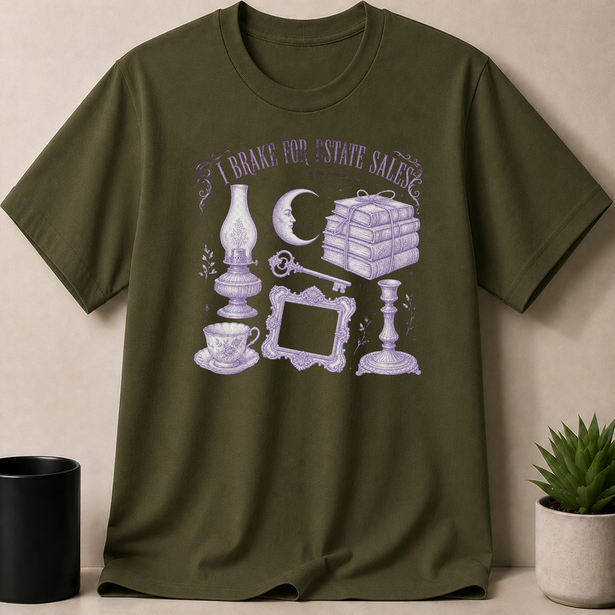 Olive green t-shirt with purple "I brake for estate sales" text and vintage illustrations.