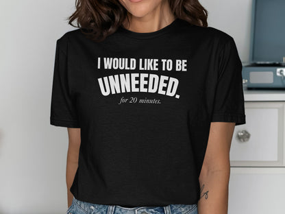 Black t-shirt with white text reading "I WOULD LIKE TO BE UNNEEDED. for 20 minutes."