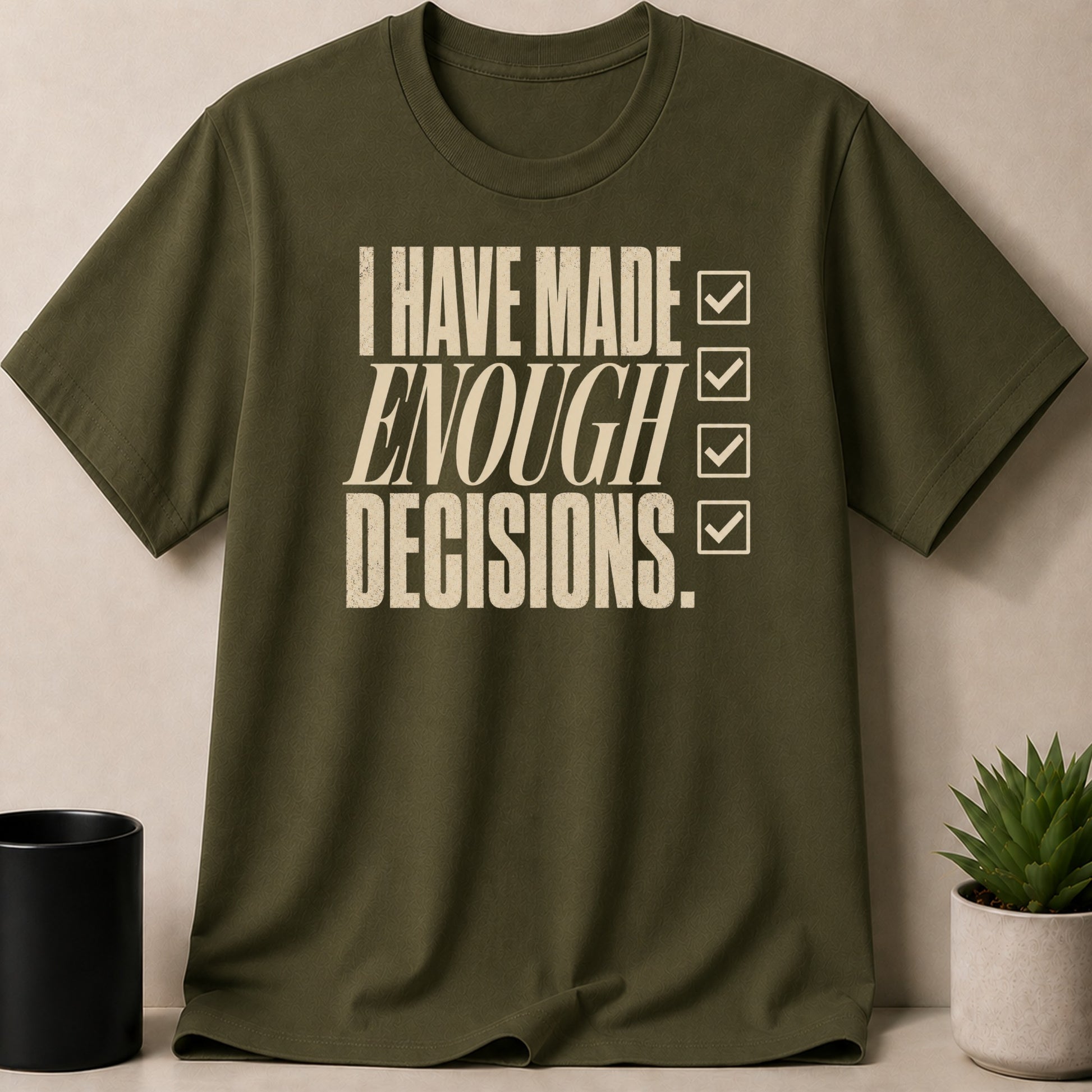 Olive green t-shirt with distressed text "I HAVE MADE ENOUGH DECISIONS." and checkmarks.