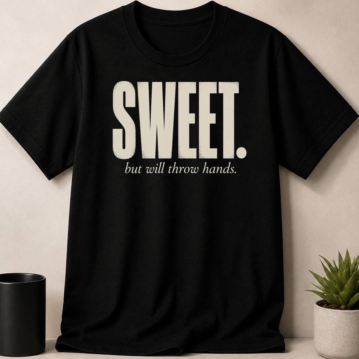 Black t-shirt with distressed white text reading "SWEET. but will throw hands."