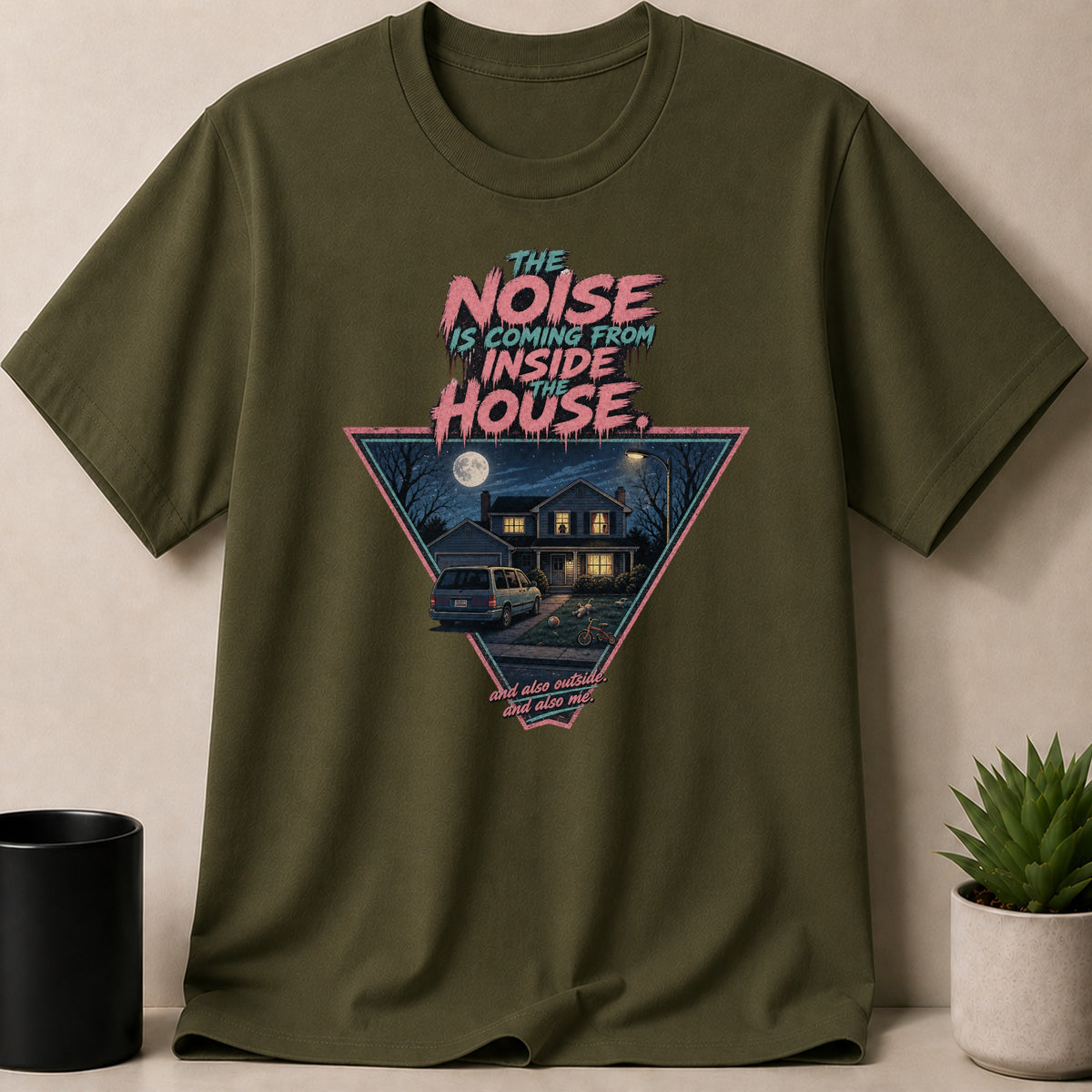 Green t-shirt graphic: "The noise is coming from inside the house" with a house at night.