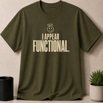 Olive green t-shirt with halo smiley face and "I APPEAR FUNCTIONAL." text.