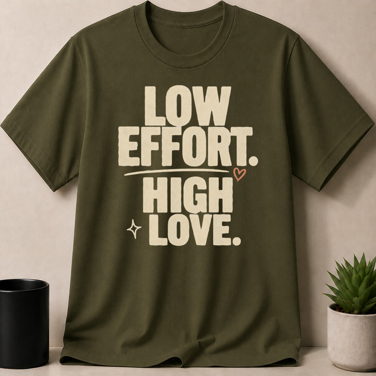 Olive green t-shirt with text "LOW EFFORT. HIGH LOVE."