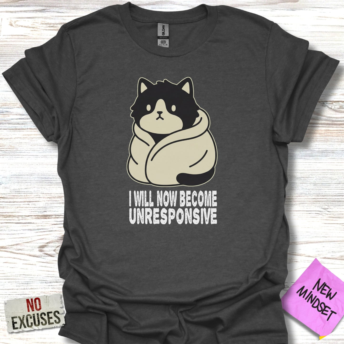 Dark t-shirt with cartoon cat wrapped in blanket, text "I WILL NOW BE UNRESPONSIVE".
