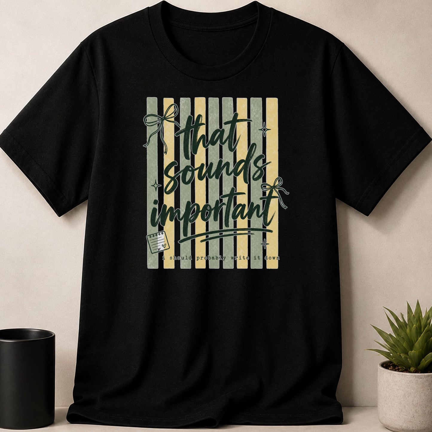 Black t-shirt with text "That sounds important" and "I should probably write it down".