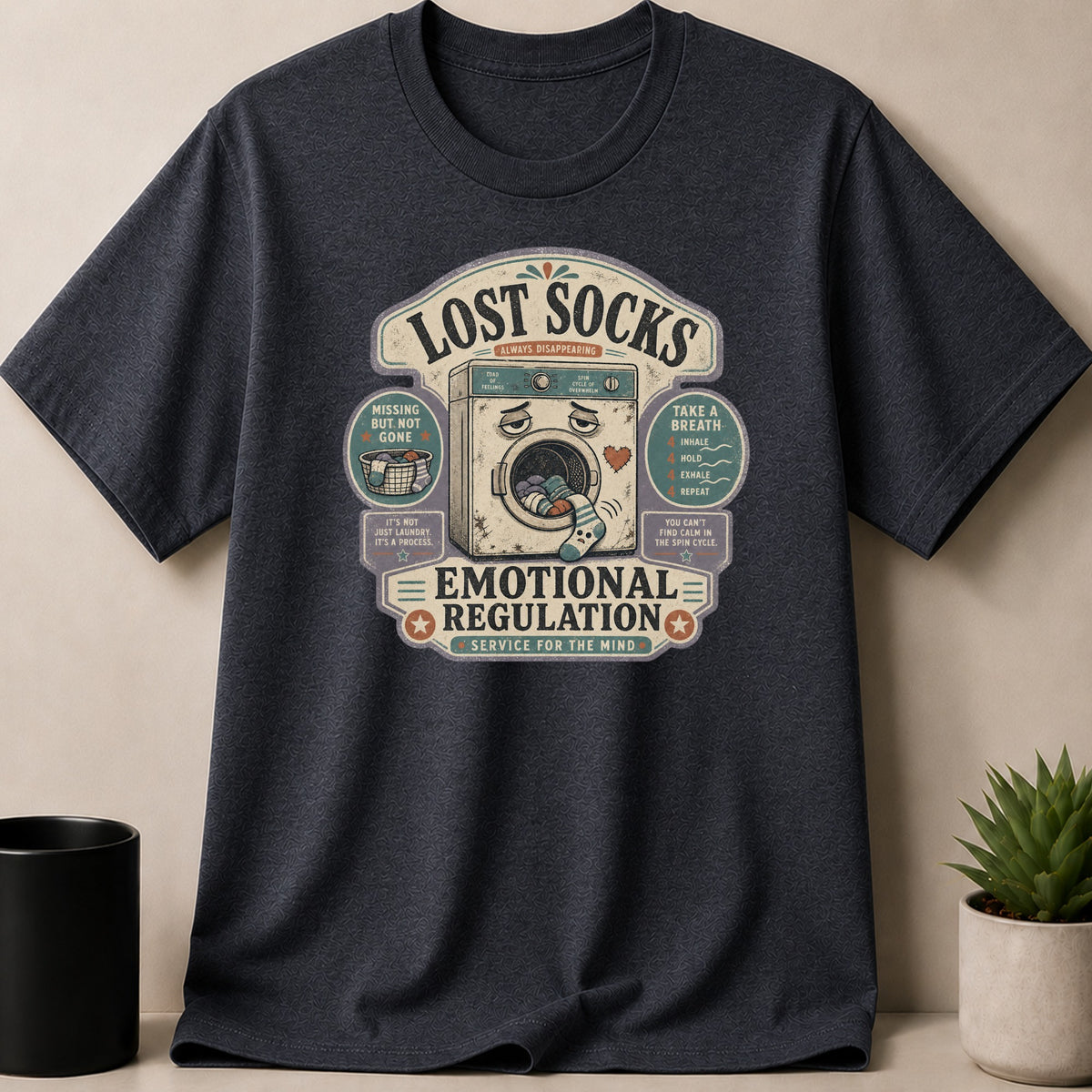 Dark t-shirt with a distressed graphic about lost socks and emotional regulation.
