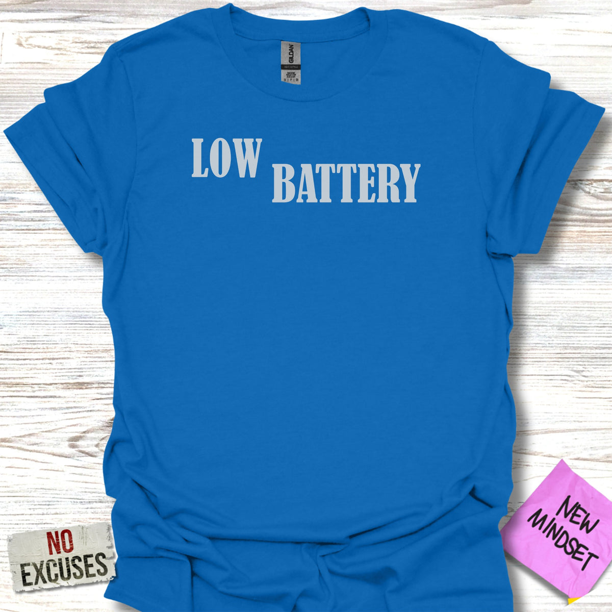 Blue t-shirt with "LOW BATTERY" and "NEW MINDSET" text.