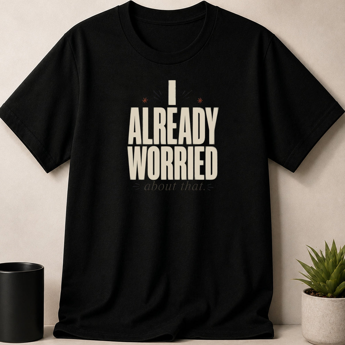 Black t-shirt with "I ALREADY WORRIED about that." text and small star graphics.