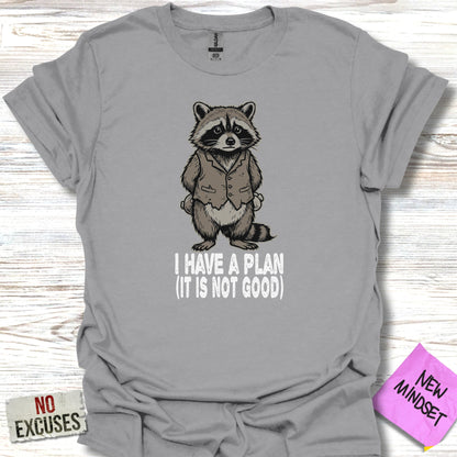 Gray t-shirt with a raccoon wearing a suit and the text "I HAVE A PLAN (IT IS NOT GOOD)".