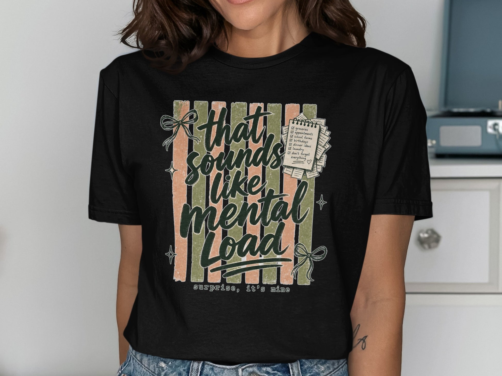 Black t-shirt with "that sounds like mental load, surprise, it's mine" and a checklist.