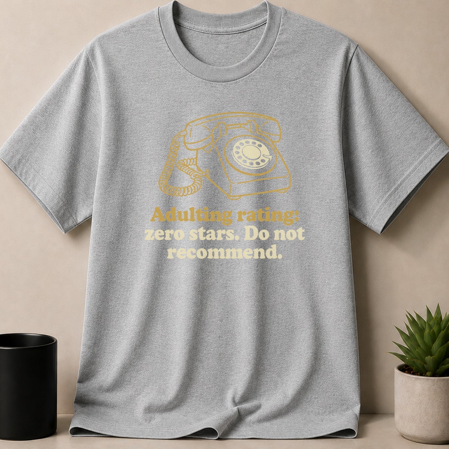Grey t-shirt with yellow graphic of rotary phone and text.
