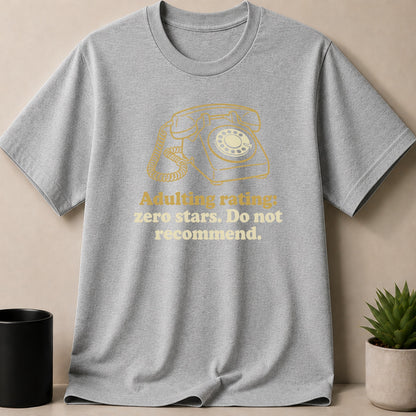 Grey t-shirt with yellow graphic of rotary phone and text.