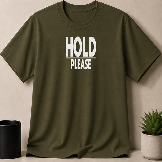 Olive green t-shirt with white text "HOLD PLEASE" on the front.