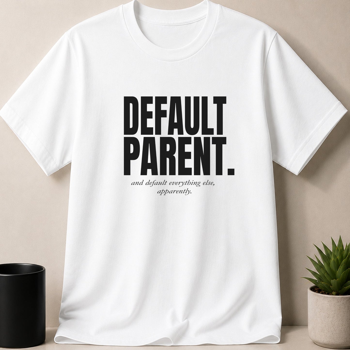 White t-shirt with "DEFAULT PARENT" and "and default everything else, apparently." text.