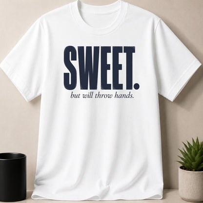 White t-shirt with navy blue text reading "SWEET. but will throw hands."