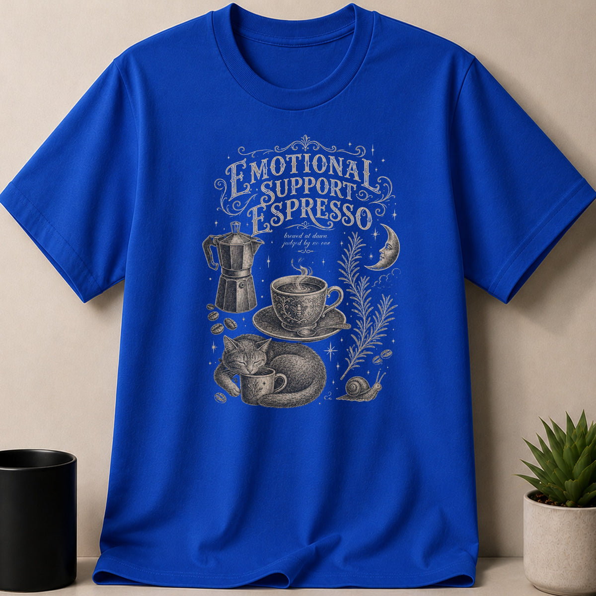 Blue t-shirt with "Emotional Support Espresso" graphic featuring cat, coffee, moon, and snail.
