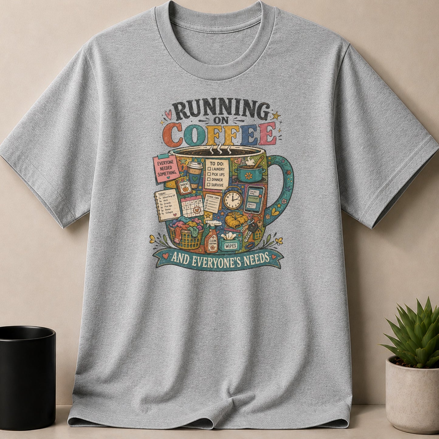 Gray t-shirt with text "Running on Coffee and Everyone's Needs."