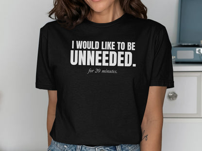 Black t-shirt with white text "I WOULD LIKE TO BE UNNEEDED. for 20 minutes."