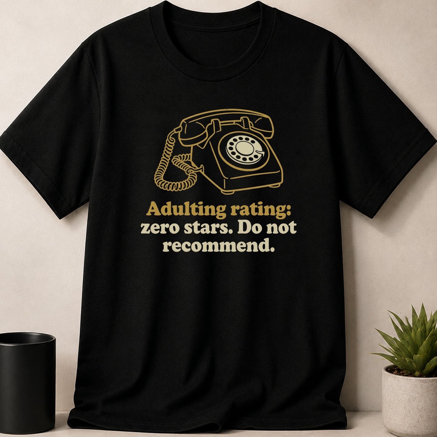 Black t-shirt with gold retro rotary phone graphic and text.